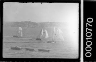 Unfocused image of an 18-footers race on Sydney Harbour
