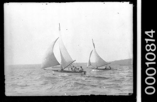 Two yachts in a close race on Sydney Harbour