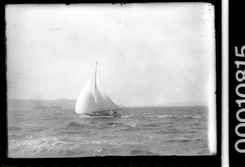 Raised-deck yacht sailing on Sydney Harbour