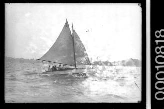 SASC yacht A12 sailing past Garden Island, Sydney Harbour