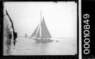 Sailing vessel with dinghy, Sydney Harbour