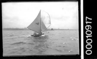 Skiff sailing near Fort Denison, Sydney Harbour