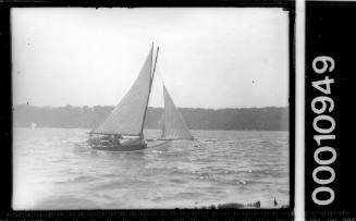 Small double-ended yacht on Sydney Harbour