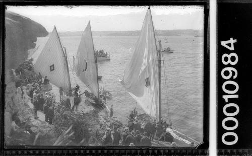 Spectators and crews waiting the start of an 18-footer race at Clark  Island