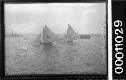 Two 18-footers and other vessels on Sydney Harbour