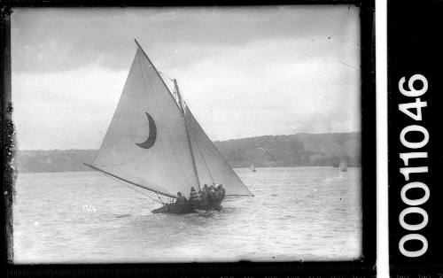 18-footer with a crescent moon on the mainsail, Sydney Harbour