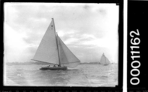 21-foot Restricted Class sloop with the text 'W 1' on the mainsail, Sydney Harbour