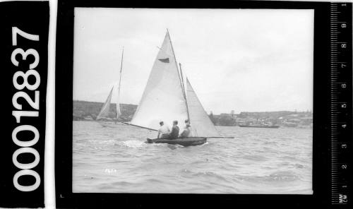 12-foot skiff with a triangle emblem on the mainsail, taken from the Vaucluse Yacht Club, Sydney Harbour