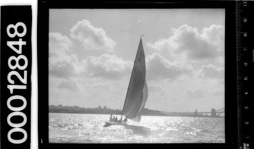 Yacht with the number '2' on the mainsail, sailing on Sydney Harbour