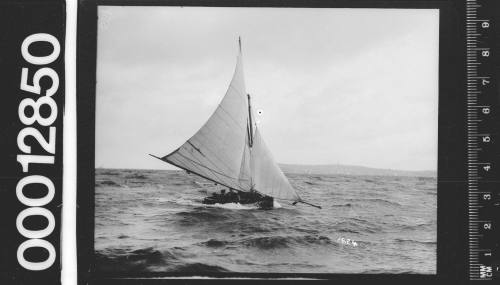 14-foot skiff under sail on Sydney Harbour