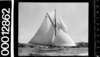 Starboard view of large yacht with the number '4' marked on the mainsail, Sydney Harbour