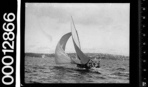 Stern view of a yacht under sail on Sydney Harbour