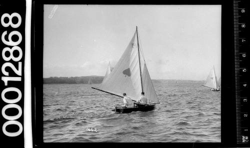 6-foot skiff yacht with a spade symbol on the mainsail, Sydney Harbour