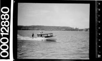 Motor launch travelling past Watsons Bay, Sydney Harbour