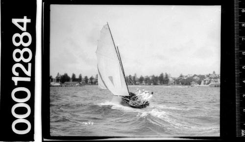 Stern view of a yacht under sail on Sydney Harbour