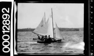 Two small yachts under sail on Sydney Harbour