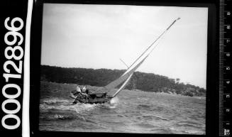 Stern view of yacht heeling to on Sydney Harbour