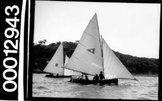 Two yachts sailing near shoreline, Sydney Harbour