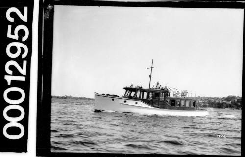 Portside view of a motor launch on Sydney Harbour