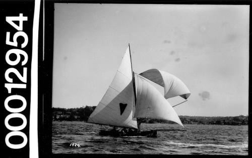 Starboard view of a yacht with a heart emblem on the mainsail, Sydney Harbour