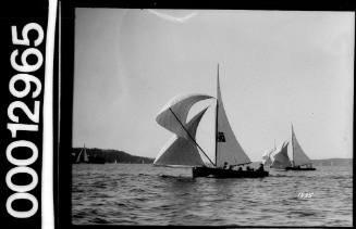 Yacht with Australian flag emblem on the mainsail, Sydney Harbour