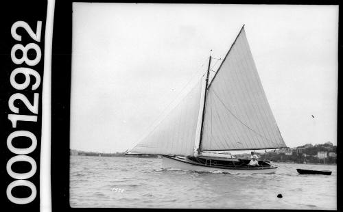 Sailing vessel towing dinghy, Sydney Harbour