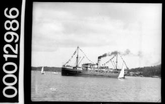 Port view of a small steamer dressed all over in flags, Sydney Harbour