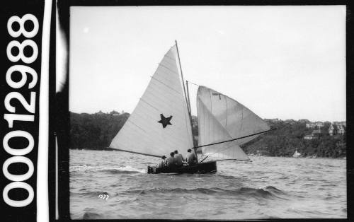 Yacht with a dark five-pointed star on the mainsail, Sydney Harbour