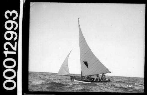 Yacht with a cone or heart shaped emblem on the mainsail, Sydney Harbour