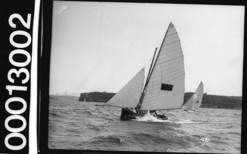 Sailing vessel with dark rectangle emblem on the mainsail, Sydney Harbour