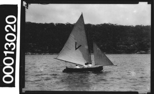 Yacht with a large letter 'V' displayed on the mainsail, Sydney Harbour