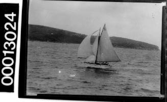 Yacht with the text 'P4' displayed at the top of the mainsail, Sydney Harbour