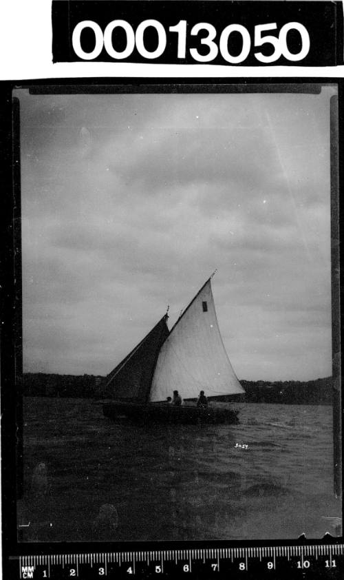 Yacht with a dark rectangle displayed on the mainsail, Sydney Harbour