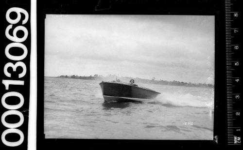 Bow view of a speedboat motoring on Sydney Harbour