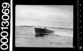 Bow view of a speedboat motoring on Sydney Harbour