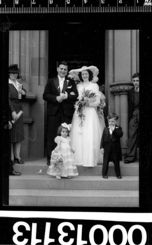 Portrait of a bride and groom leaving St Marys Cathedral, Sydney