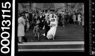 Portrait of bride and groom leaving St Marys Cathedral, Sydney