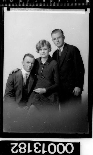 Portrait of two men and a woman, all unidentified