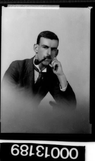 Portrait of an unidentified man smoking a pipe