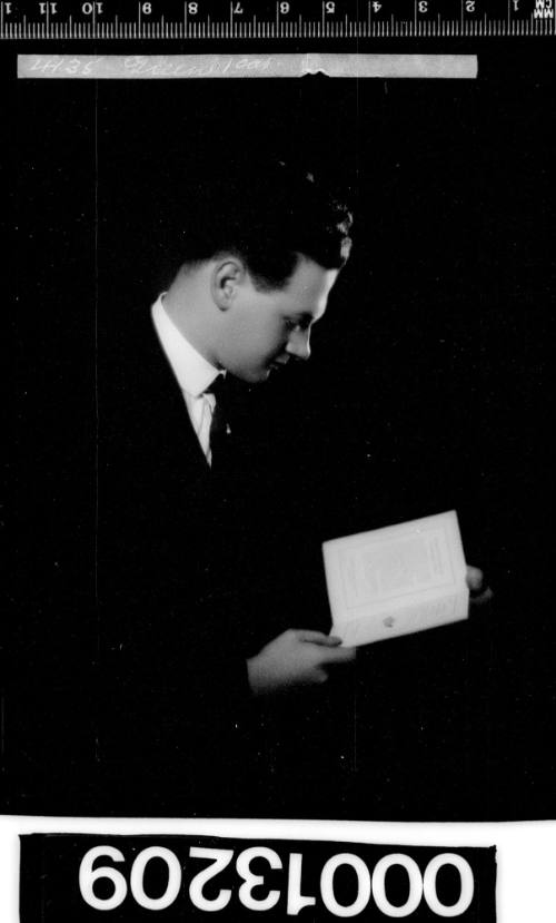 Portrait of a man reading a book