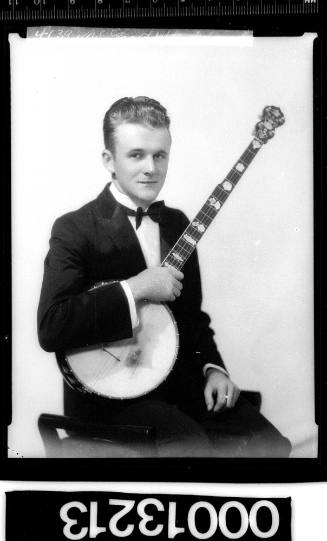 Portrait of a man holding a banjo