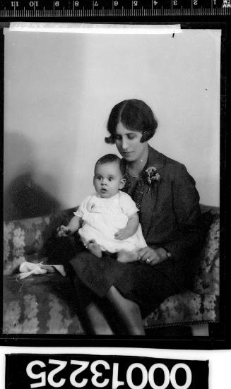 Portrait of a woman holding a baby