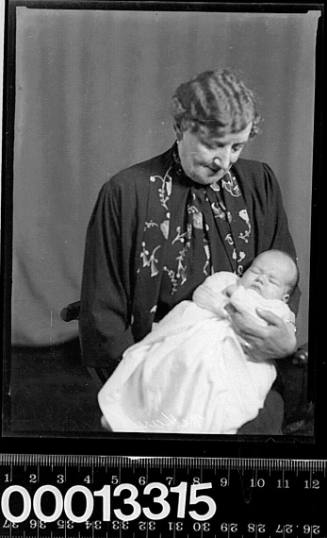 Portrait of a woman holding a baby