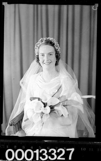 Wedding portrait of a bride holding a bouquet