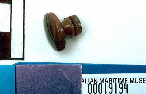 Plastic button belonging to Captain Robert McKilliam