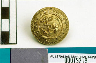 Aberdeen White Star Line large round brass button with gilt on front and raised relief pattern of fouled anchor with flag pole and flag with single star and line through middle