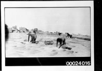 African women digging