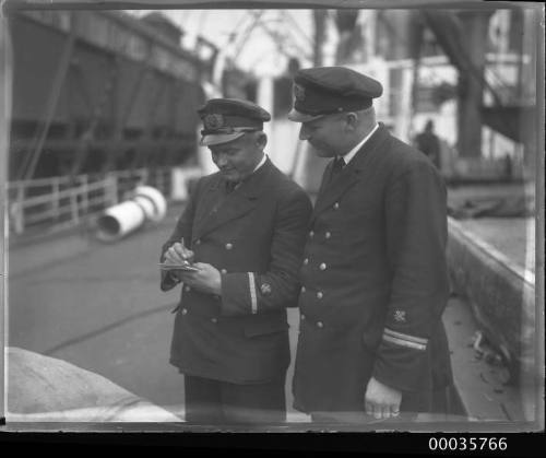 SS ALLER, two ship's officers in conversation