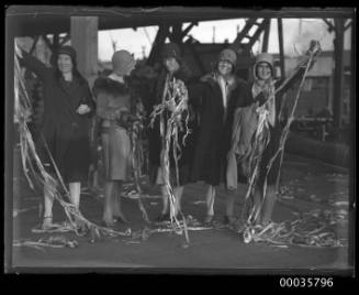 Five women with streamers at arrival or departure of SS ORUNGAL