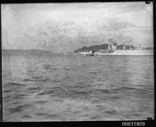 Seaplane and two warships in Sydney Harbour